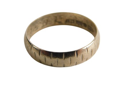 Lot 344 - A 9ct gold wedding band, with engraved...