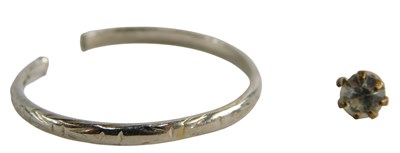 Lot 349 - A white metal wedding band, cut, stamped...