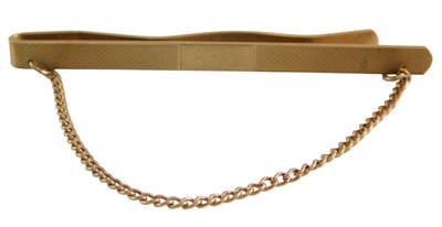Lot 49 - A 9ct gold tie slide, with engine turned...