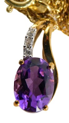 Lot 55 - A 9ct gold amethyst and diamond pendant, with...