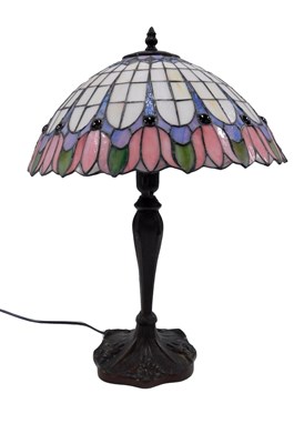 Lot 763 - A Tiffany style lamp, with stained glass and...