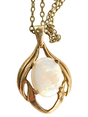 Lot 51 - A 9ct gold and opal pendant, on a fine link...
