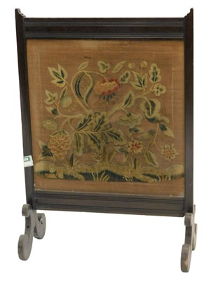 Lot 893 - An early 20thC mahogany firescreen, with...