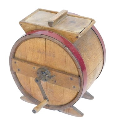 Lot 821 - An oak and puce painted butter churn, stamped...
