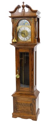 Lot 810 - A modern oak cased longcase clock, the arched...