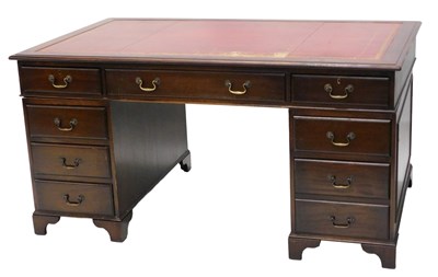 Lot 827 - A mahogany pedestal desk, the rectangular top...