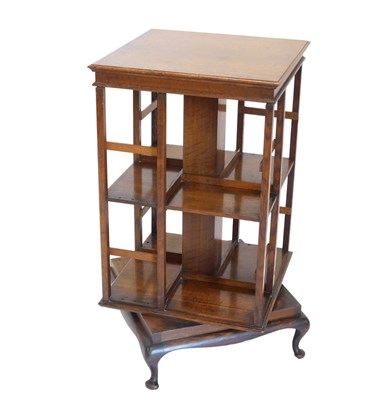 Lot 847 - An Edwardian oak revolving bookcase, the...