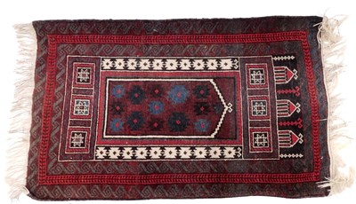 Lot 935 - A Baluch Afghan burgundy ground prayer...