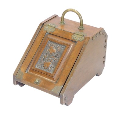 Lot 849 - A late 19thC oak coal scuttle, the door carved...