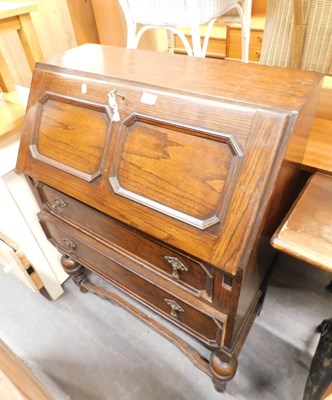 Lot 1536 - An oak bureau, drop down upper cupboard/desk,...