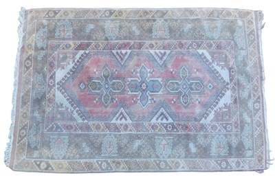 Lot 776 - A Turkish green ground rug, with three...
