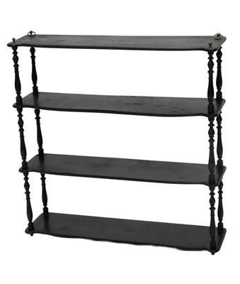 Lot 855 - A late 19thC ebonised wall shelf, with four...