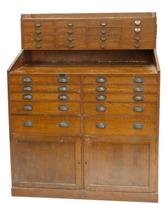 Lot 898 - An early 20thC oak apothecary shop or workshop...