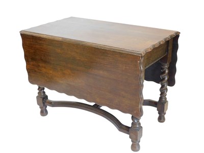 Lot 859 - An early 20thC oak dropleaf table, the...