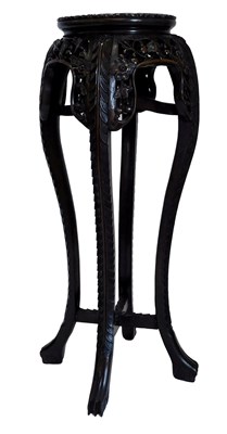 Lot 871 - A Chinese hardwood urn table, the circular top...