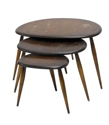 Lot 888 - A nest of Ercol dark elm pebble occasional...