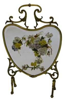 Lot 786 - An early 20thC brass fire screen, the heart...