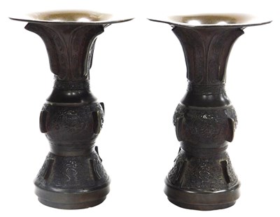 Lot 18 - A pair of Archaic style Chinese bronze gu...