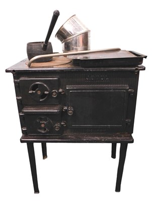 Lot 822 - A Jotul black enamelled cast iron stove, etc.