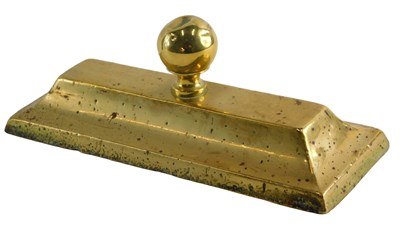 Lot 583 - A 19thC brass and lead door stop of ingot...