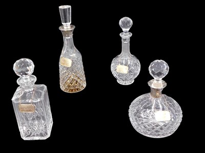 Lot 589 - Two cut glass decanters, each with a silver...