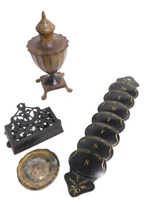 Lot 748 - A Toleware letter rack, decorated with wheat...