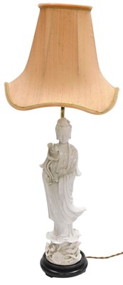 Lot 22 - A Chinese blanc-de-chine porcelain figure of...