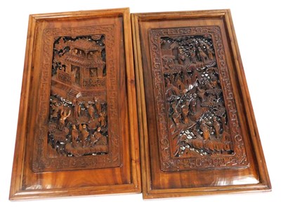 Lot 117 - A pair of 19thC Chinese carved hardwood panels,...