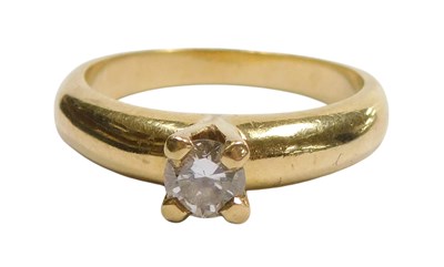 Lot 307 - A diamond solitaire ring, high claw set, in...
