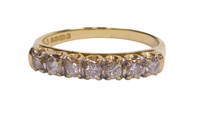 Lot 120 - An 18ct gold and diamond seven stone ring, in...