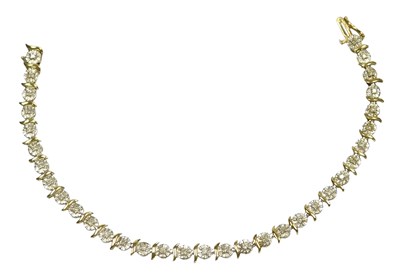 Lot 53 - A 9ct gold and diamond bracelet, each tiny...