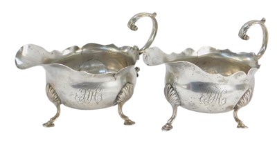 Lot 35 - A pair of George II silver sauce boats, with S...
