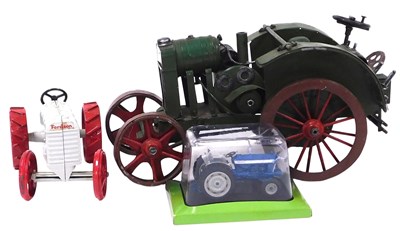 Lot 136 - A tin plate John Deere tractor, together with...