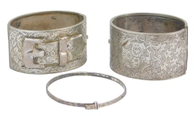 Lot 73 - Two white metal cuff bangles, one bright cut...
