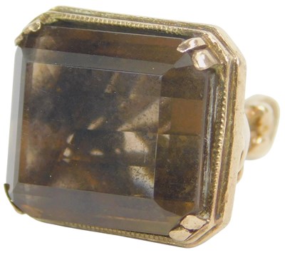 Lot 81 - A seal fob, inset with an emerald cut smokey...