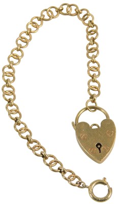 Lot 82 - A 9ct gold interlinked bracelet, with a heart...