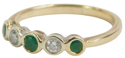 Lot 83 - An emerald and diamond five stone ring, yellow...
