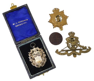 Lot 62 - Two miniature brass cap badges, comprising...