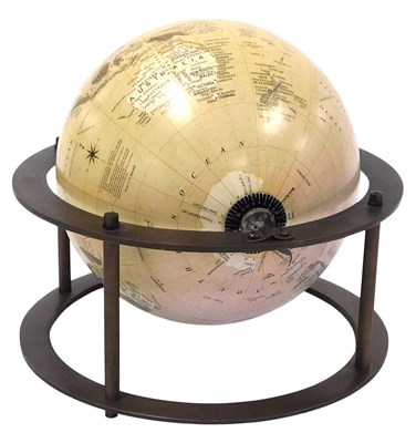 Lot 65 - A terrestrial globe, in a brass circular frame,...