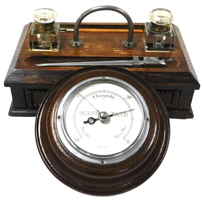 Lot 67 - An early 20thC oak desk stand, with a pair of...