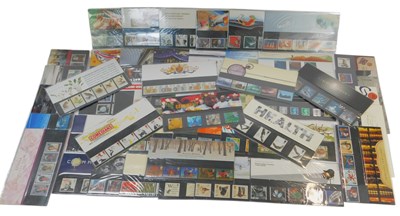 Lot 217 - Fifty Royal Mail stamp presentation packs, to...