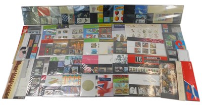 Lot 218 - Fifty Royal Mail stamp presentation packs, to...