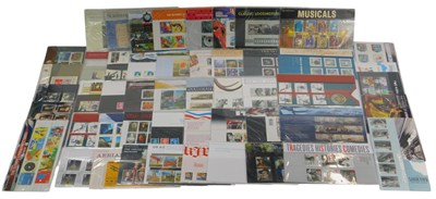 Lot 219 - Fifty Royal Mail stamp presentation packs, to...
