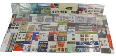 Lot 220 - Fifty Royal Mail stamp presentation packs, to...