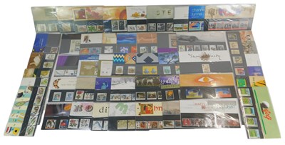 Lot 221 - Fifty Royal Mail stamp presentation packs, to...