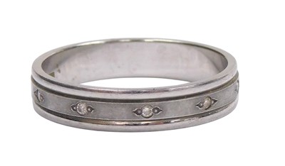 Lot 179 - A platinum wedding band, set with five tiny...