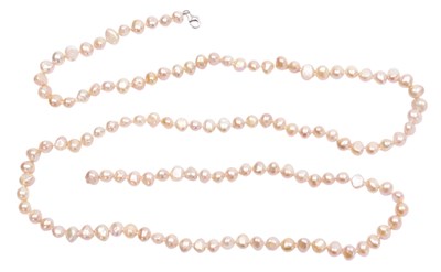 Lot 130 - A string of pink freshwater pearls, on a...