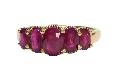 Lot 194 - A 9ct gold and ruby five stone ring, set with...