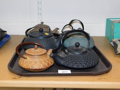 Lot 2077 - Six Oriental style cast iron teapots.