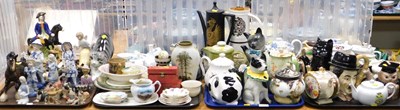Lot 2108 - A group of novelty teapots, to include cats,...